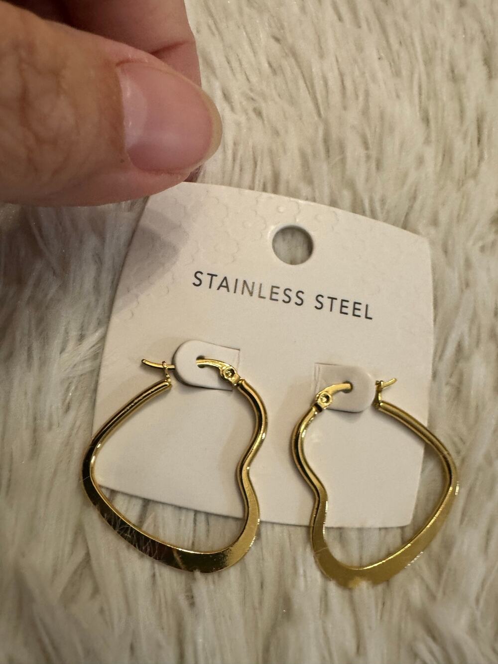 Gold stainless steel hoop earrings with a heart shaped design